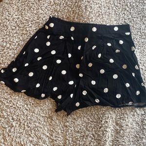 Black shorts with white polka dots